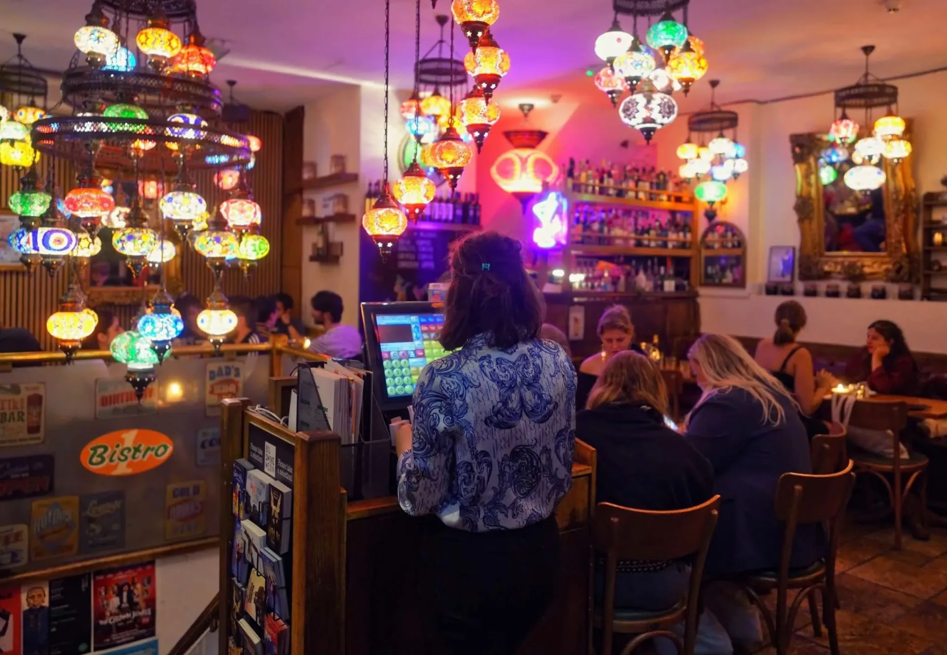 The colourful lamp-lit dining room at Bistro 1 in Soho, London